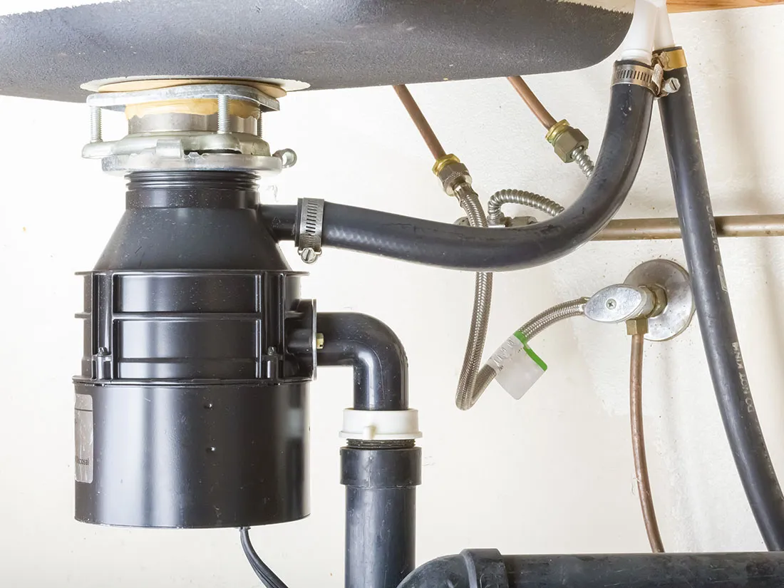 Garbage disposal under a kitchen sink